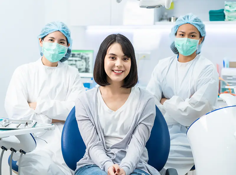Prosthodontist providing specialized dental treatment to a patient Prosthodontist providing specialized dental treatment to a patient