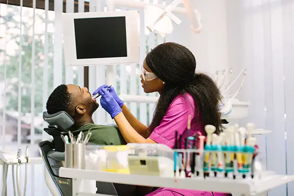 Prosthodontist performing advanced dental restoration procedures