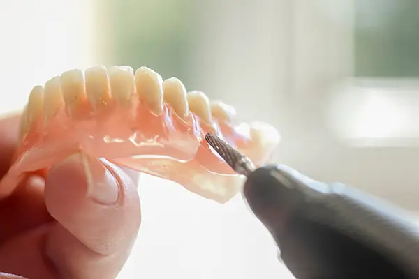 Removable partial denture with metal clasps for replacing missing teeth